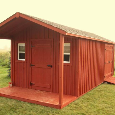 10 x 20 high board and batten with a 4 foot gable porch.
